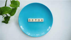 plate with letters spelling detox on it, showing how hydrotherapy of the colon can help detox your body